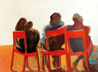 Three spactators on red chairs